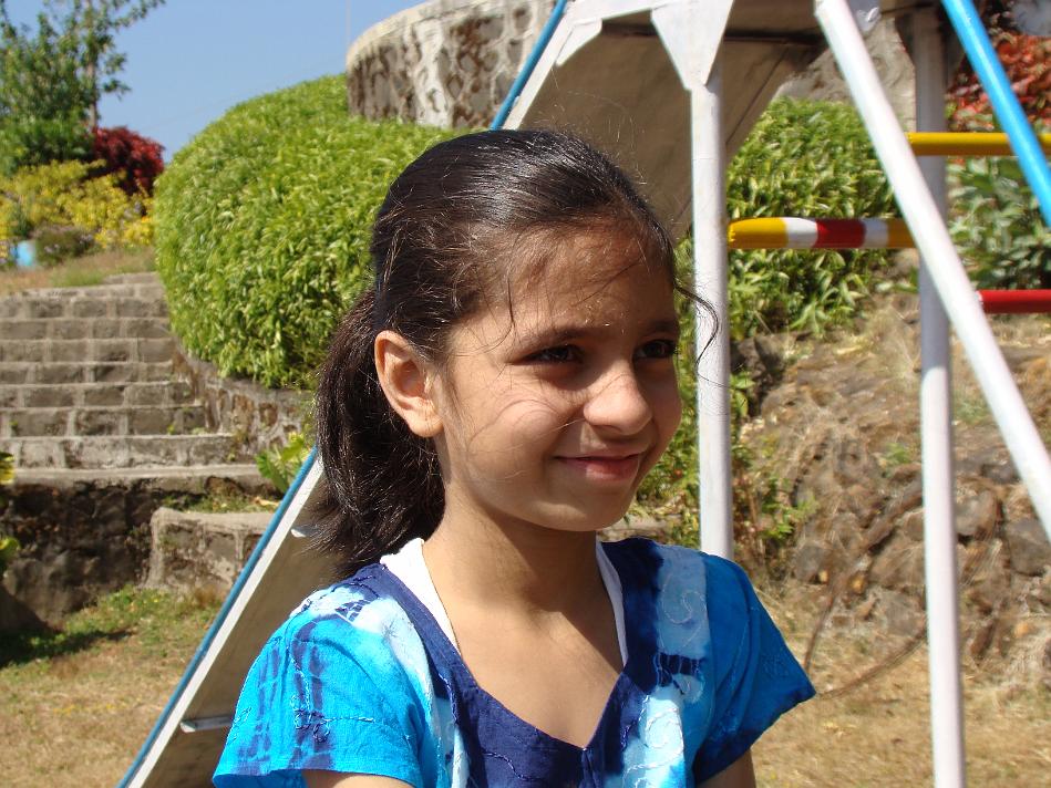 DSC02014.JPG - Tanvi near slide in Puja Farm. There is a slide, seesaw and couple of swings for kids in the Puja Farm premises